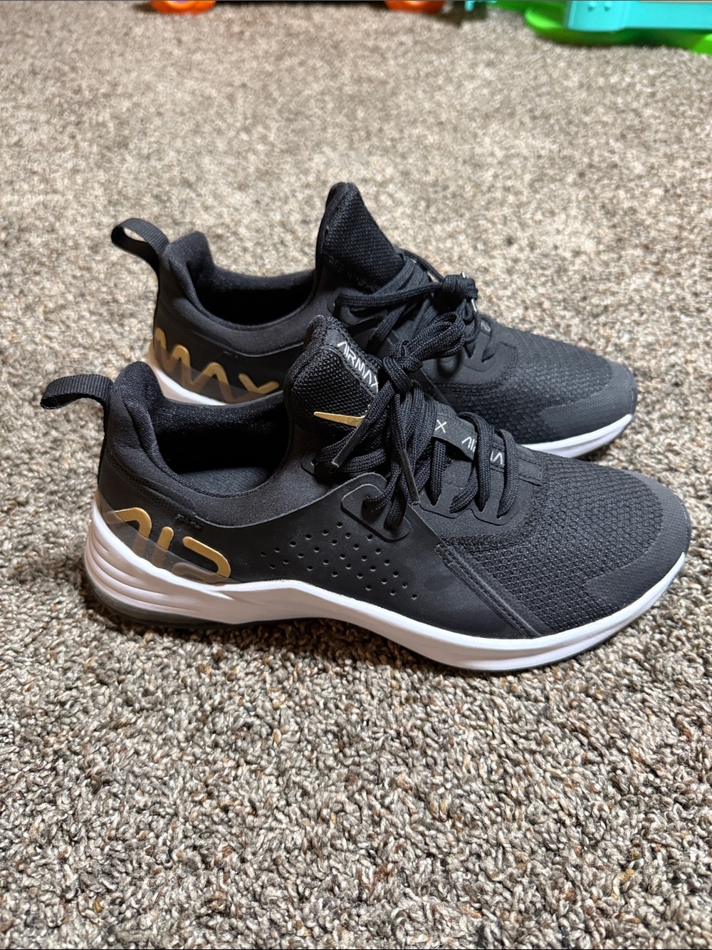 Nike Men’s Black Athletic Sneakers with Gold Accents